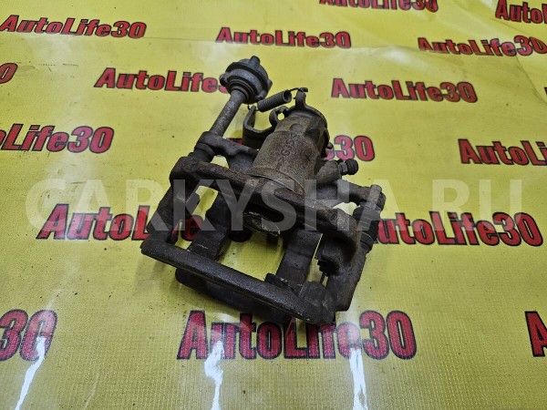 Суппорт тормозной задний правый Opel Astra 