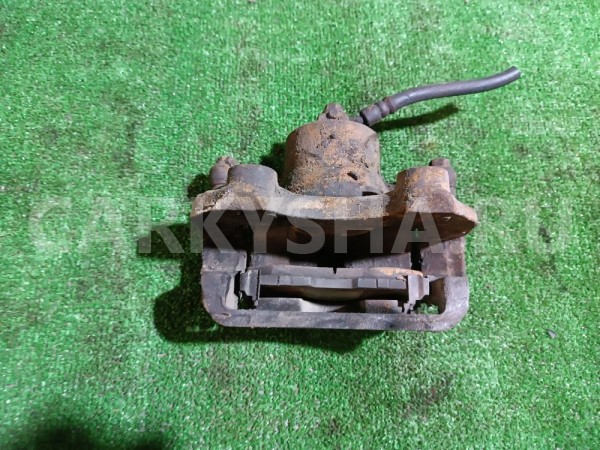 Суппорт тормозной передний правый Nissan Cefiro 