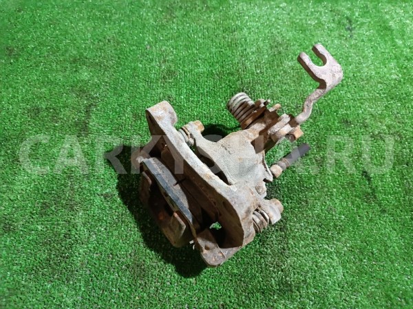 Суппорт тормозной задний правый Nissan Cefiro 