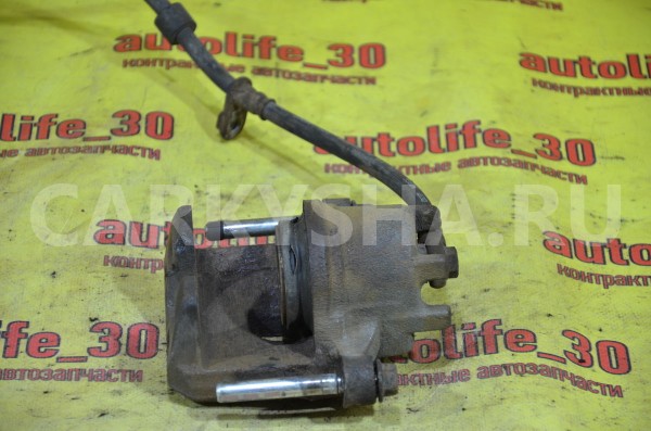 Суппорт тормозной передний левый Mitsubishi Colt 