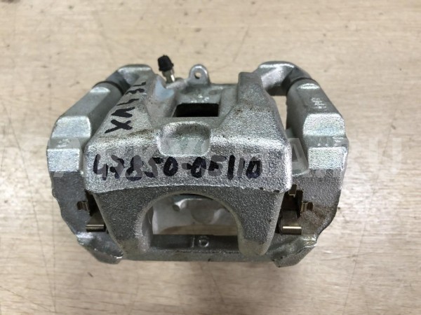 Суппорт задний левый Toyota Highlander IV (U70) оригинальный номер 47850-0E110