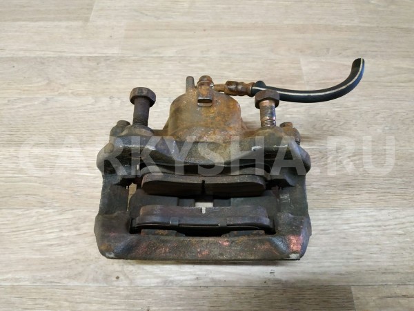 Суппорт тормозной передний правый Nissan Primera 