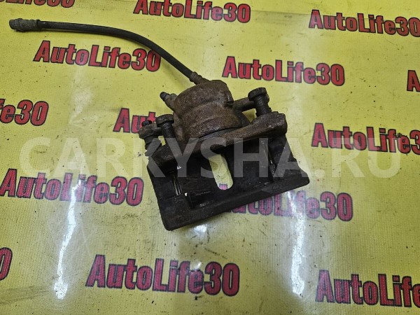 Суппорт тормозной передний левый Nissan Almera 