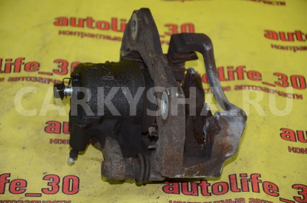 Суппорт тормозной передний левый Toyota Auris 