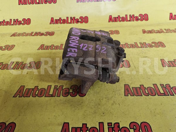 Суппорт тормозной передний левый Land Rover Freelander 