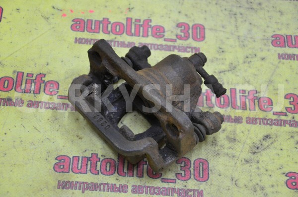 Суппорт тормозной задний левый Nissan Qashqai 