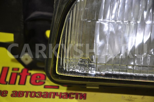 Фара левая Mazda 323 
